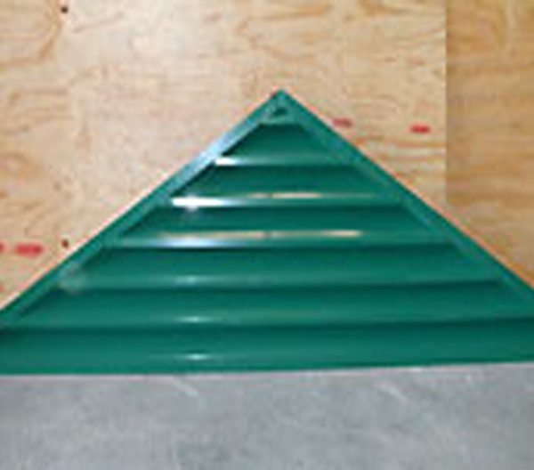 a green triangle gable louver